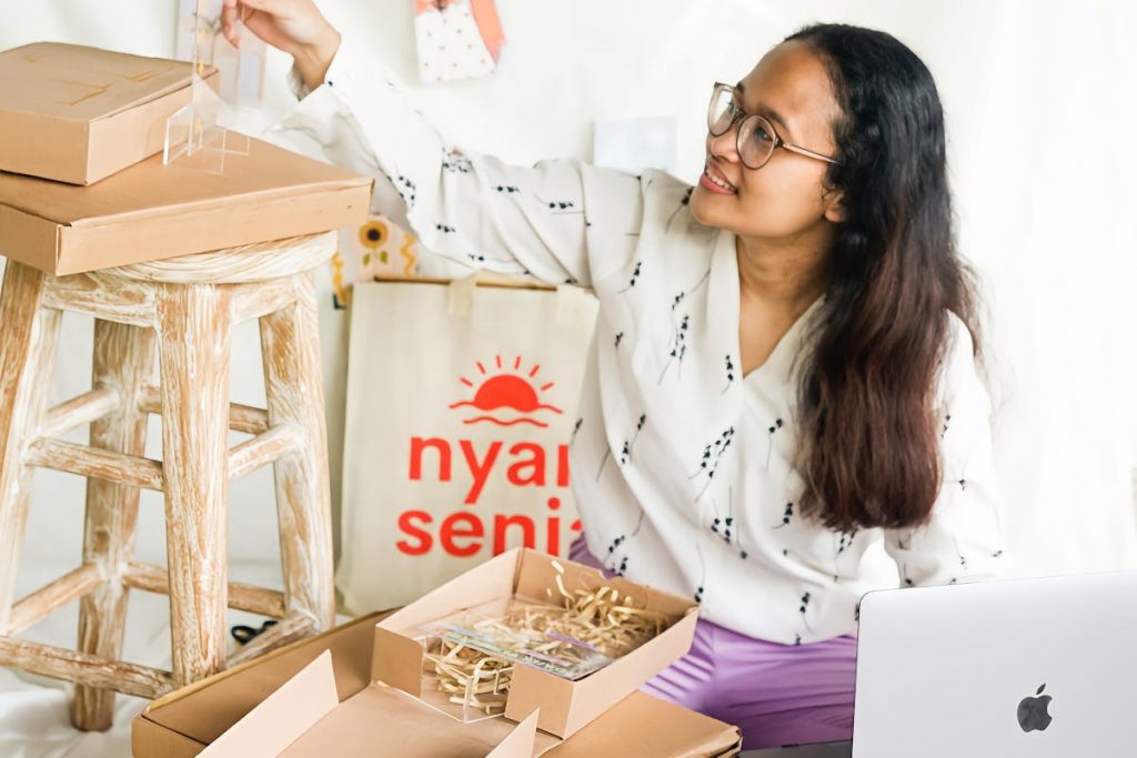 an entrepreneur packing some products