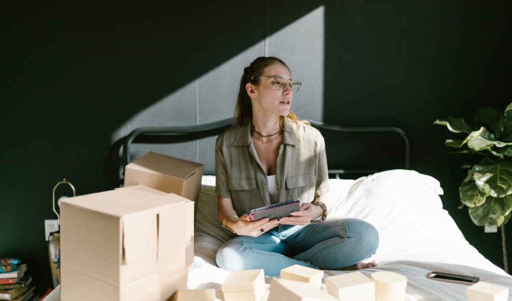a female entrepreneur with some boxes for her products